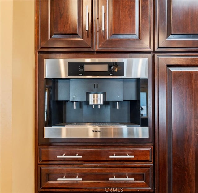 805 Ocean Ave Unit 6, Seal Beach, CA 90740 - kitchen view of stainless steel oven and dark brown cabinetry