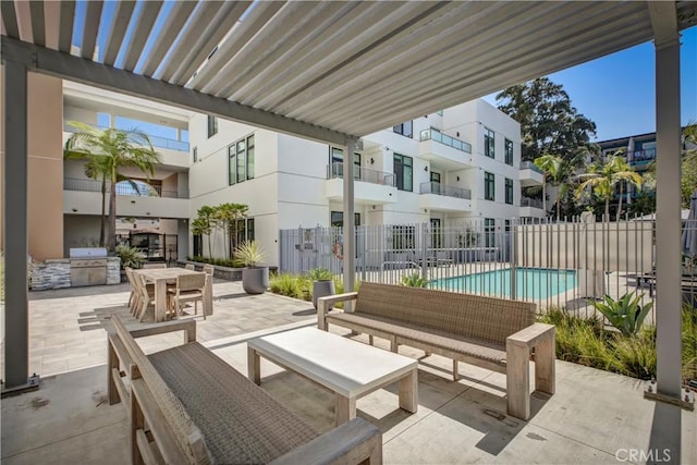 399 E Del Mar Blvd Unit 110, Pasadena, CA 91101 - view of patio / terrace featuring a community pool and a grill