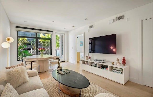 399 E Del Mar Blvd Unit 110, Pasadena, CA 91101 - living area featuring light wood finished floors and baseboards