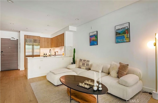 399 E Del Mar Blvd Unit 110, Pasadena, CA 91101 - living area featuring light wood-style floors and recessed lighting