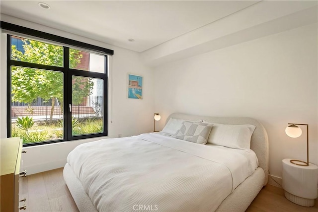 399 E Del Mar Blvd Unit 110, Pasadena, CA 91101 - bedroom featuring wood finished floors and baseboards