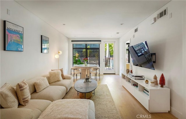 399 E Del Mar Blvd Unit 110, Pasadena, CA 91101 - living area with light wood-style flooring