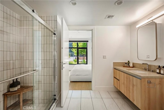 399 E Del Mar Blvd Unit 110, Pasadena, CA 91101 - bathroom featuring tile patterned flooring, vanity, a shower stall, ensuite bath, and recessed lighting