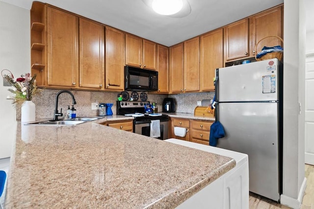 1280 W Main St Unit 42, El Cajon, CA 92020 - kitchen with appliances with stainless steel finishes, open shelves, light countertops, and brown cabinetry