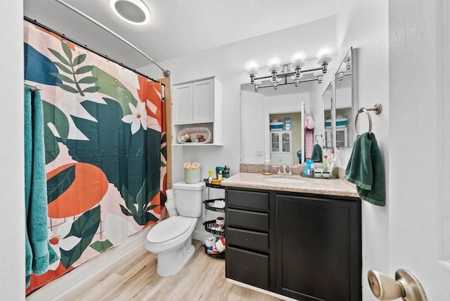 1280 W Main St Unit 42, El Cajon, CA 92020 - full bathroom with vanity, wood finished floors, and a shower with shower curtain