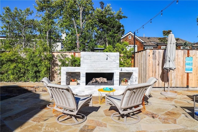1954 Port Locksleigh Pl, Newport Beach, CA 92660 - view of patio / terrace with an outdoor brick fireplace