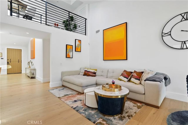 1954 Port Locksleigh Pl, Newport Beach, CA 92660 - living area with wood finished floors, a towering ceiling, and recessed lighting