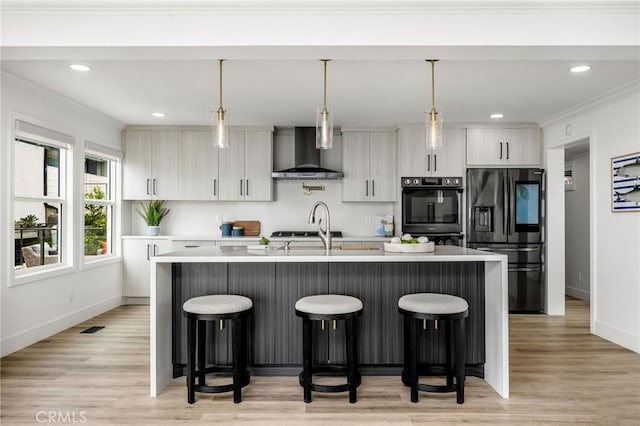 32015 Point Pl, Laguna Beach, CA 92651 - kitchen featuring refrigerator with ice dispenser, wall chimney exhaust hood, light countertops, a kitchen bar, and an island with sink