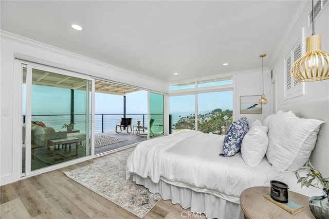 32015 Point Pl, Laguna Beach, CA 92651 - bedroom featuring access to exterior, ornamental molding, wood finished floors, a water view, and recessed lighting