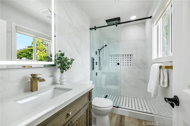 32015 Point Pl, Laguna Beach, CA 92651 - full bath featuring vanity, a marble finish shower, healthy amount of natural light, and wood finished floors