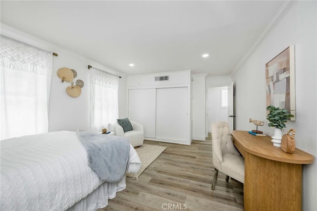 32015 Point Pl, Laguna Beach, CA 92651 - bedroom with ornamental molding, light wood-type flooring, recessed lighting, and a closet