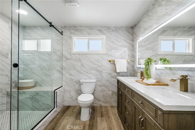 32015 Point Pl, Laguna Beach, CA 92651 - bathroom with double vanity, a stall shower, wood finished floors, and tile walls