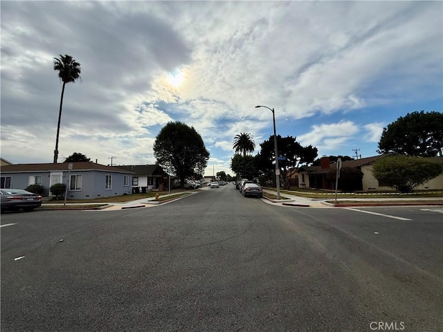5901 California Ave, Long Beach, CA 90805 - view of asphalt road with sidewalks, curbs, street lighting, and a residential view