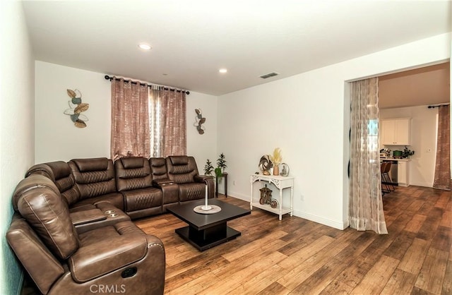 2698 N Arroyo Ave, Fresno, CA 93727 - living area with wood-type flooring and recessed lighting