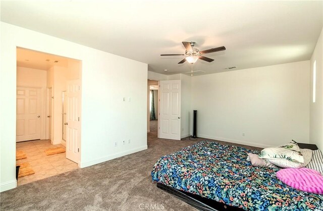 2698 N Arroyo Ave, Fresno, CA 93727 - carpeted bedroom with baseboards and a ceiling fan
