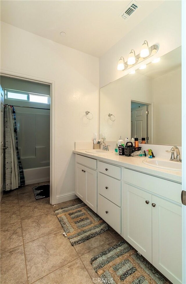 2698 N Arroyo Ave, Fresno, CA 93727 - bathroom with double vanity and tile patterned flooring