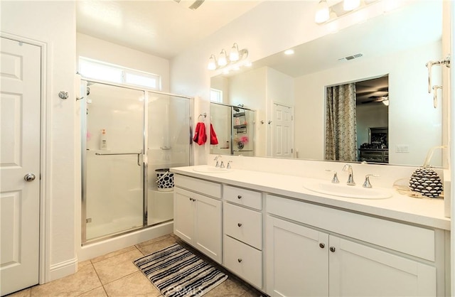 2698 N Arroyo Ave, Fresno, CA 93727 - full bathroom featuring double vanity, a shower stall, and tile patterned flooring