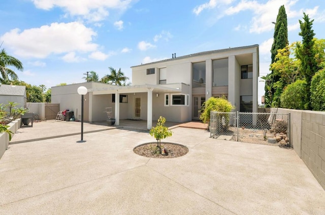 3112 N Mountain View Dr, San Diego, CA 92116 - rear view of house with a patio, stucco siding, and a gate