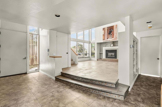 3112 N Mountain View Dr, San Diego, CA 92116 - foyer entrance featuring stairway and a fireplace with raised hearth