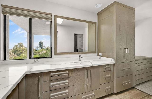 3112 N Mountain View Dr, San Diego, CA 92116 - bathroom featuring double vanity and wood finished floors