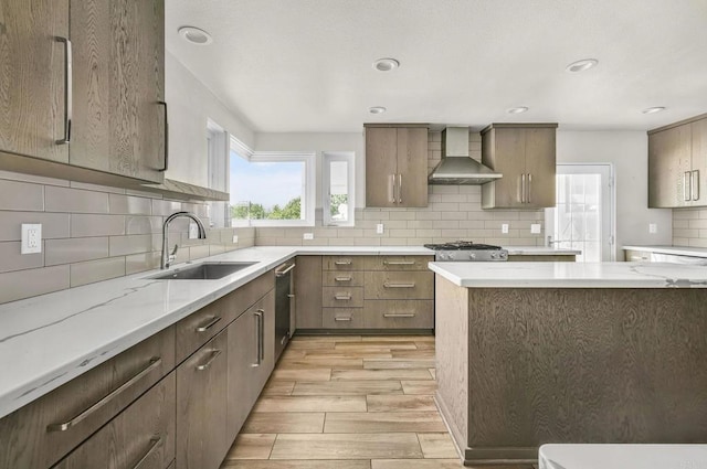 3112 N Mountain View Dr, San Diego, CA 92116 - kitchen featuring wall chimney exhaust hood, light wood-style flooring, plenty of natural light, backsplash, and recessed lighting