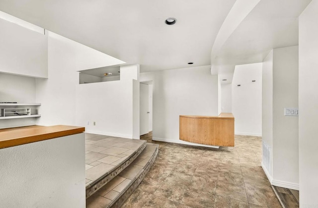 3112 N Mountain View Dr, San Diego, CA 92116 - kitchen with baseboards and stone finish flooring