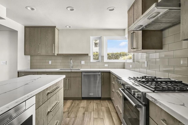 3112 N Mountain View Dr, San Diego, CA 92116 - kitchen with appliances with stainless steel finishes, custom range hood, light wood-type flooring, recessed lighting, and light stone counters