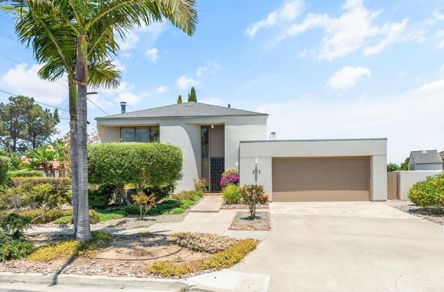 3112 N Mountain View Dr, San Diego, CA 92116 - view of front of property featuring stucco siding, driveway, and an attached garage