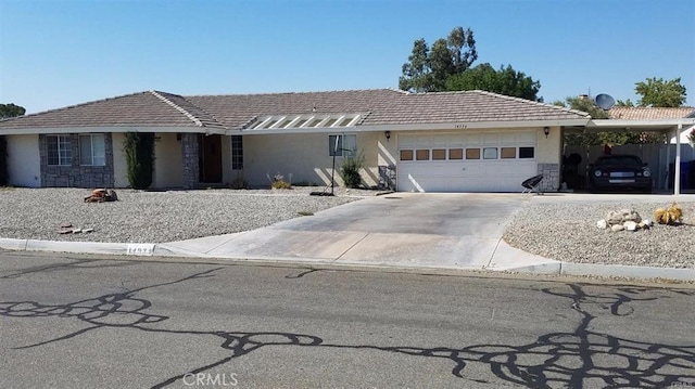 14934 Autumn Ln, Helendale, CA 92342 - single story home featuring stone siding, stucco siding, and an attached garage