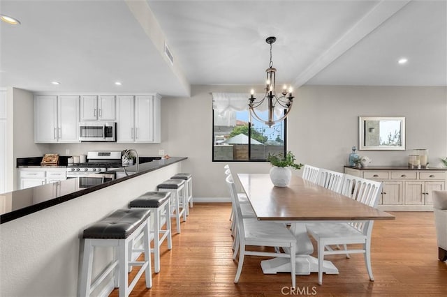 220 S Prospect Ave Unit 9, Redondo Beach, CA 90277 - dining space featuring a chandelier, recessed lighting, and light wood finished floors