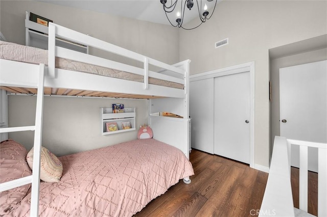 220 S Prospect Ave Unit 9, Redondo Beach, CA 90277 - bedroom with wood finished floors, a closet, a chandelier, and a high ceiling