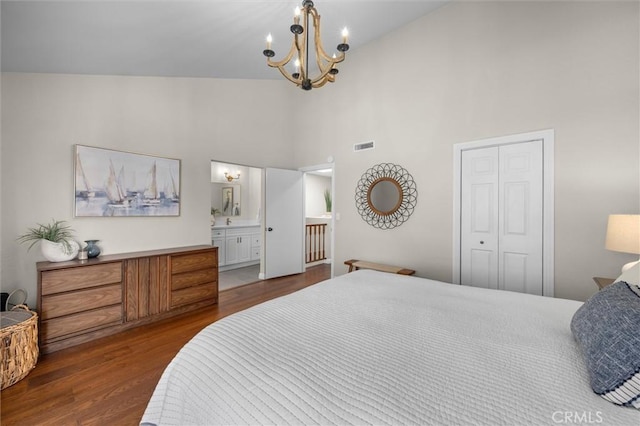 220 S Prospect Ave Unit 9, Redondo Beach, CA 90277 - bedroom featuring a towering ceiling, wood finished floors, a chandelier, a closet, and ensuite bathroom