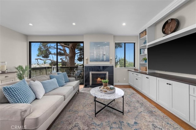220 S Prospect Ave Unit 9, Redondo Beach, CA 90277 - living room featuring light wood-style floors, a high end fireplace, and recessed lighting