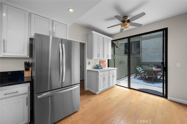 220 S Prospect Ave Unit 9, Redondo Beach, CA 90277 - kitchen with freestanding refrigerator, light wood-style floors, recessed lighting, a ceiling fan, and white cabinets