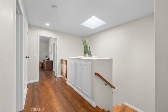 220 S Prospect Ave Unit 9, Redondo Beach, CA 90277 - corridor with an upstairs landing, a skylight, wood finished floors, and recessed lighting