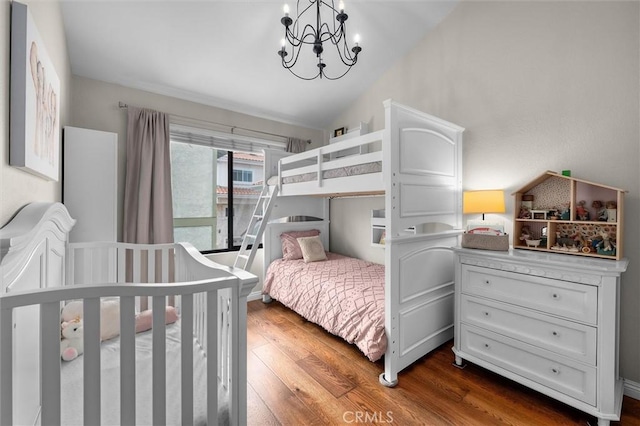 220 S Prospect Ave Unit 9, Redondo Beach, CA 90277 - bedroom with dark wood-style flooring, lofted ceiling, and a chandelier