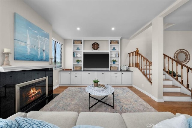220 S Prospect Ave Unit 9, Redondo Beach, CA 90277 - living area featuring light wood-style flooring, stairway, recessed lighting, and a tiled fireplace