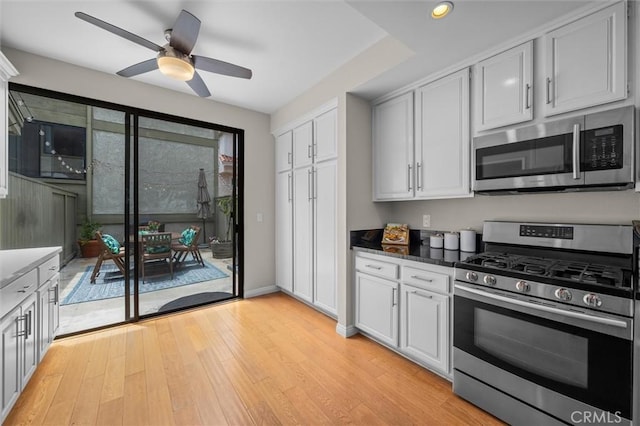220 S Prospect Ave Unit 9, Redondo Beach, CA 90277 - kitchen featuring appliances with stainless steel finishes, ceiling fan, light wood-style floors, recessed lighting, and white cabinets
