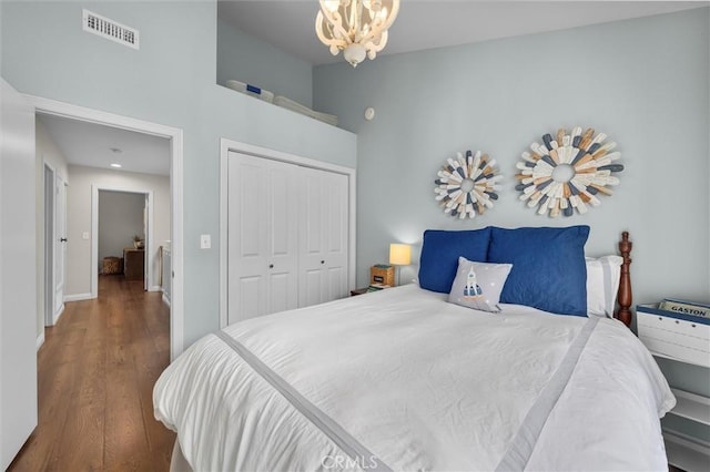 220 S Prospect Ave Unit 9, Redondo Beach, CA 90277 - bedroom with high vaulted ceiling, a closet, a chandelier, and wood finished floors