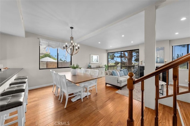 220 S Prospect Ave Unit 9, Redondo Beach, CA 90277 - dining room with healthy amount of natural light, light wood-style floors, a chandelier, recessed lighting, and stairs