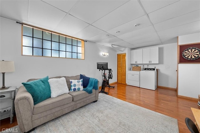 220 S Prospect Ave Unit 9, Redondo Beach, CA 90277 - living area with washer and clothes dryer, wood finished floors, and a paneled ceiling