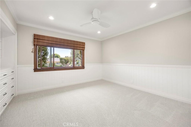1831 Cockscrow Ln, North Tustin, CA 92705 - spare room with a wainscoted wall, light carpet, a ceiling fan, recessed lighting, and crown molding