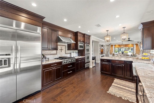 1831 Cockscrow Ln, North Tustin, CA 92705 - kitchen featuring appliances with stainless steel finishes, ventilation hood, dark brown cabinetry, backsplash, and recessed lighting
