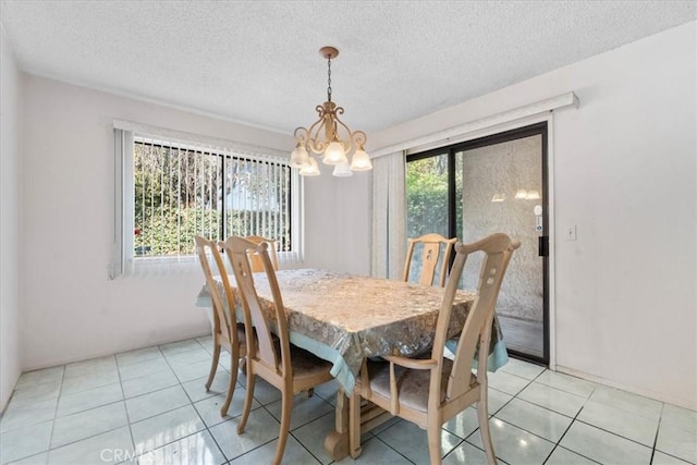 406 Genoa St Unit A, Monrovia, CA 91016 - dining space featuring a chandelier, light tile patterned floors, and a textured ceiling