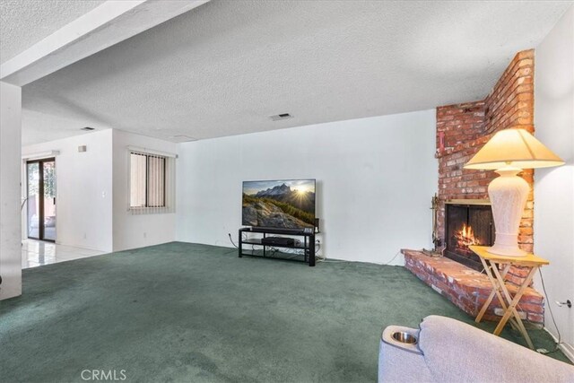 406 Genoa St Unit A, Monrovia, CA 91016 - living area with carpet floors, a textured ceiling, and a fireplace