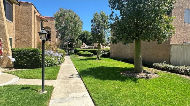 13722 Red Hill Ave Unit 20, Tustin, CA 92780 - view of home's community featuring a lawn