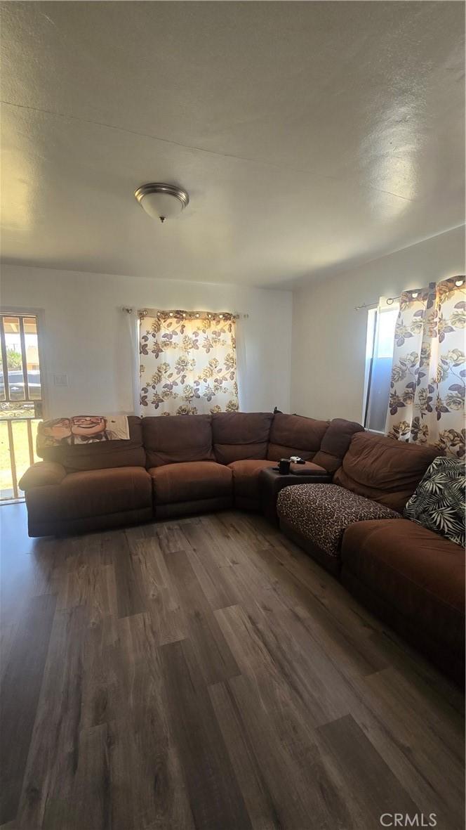 9023 Olive St, Fontana, CA 92335 - living room with wood finished floors