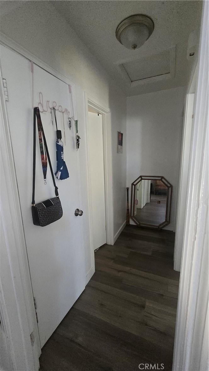 9023 Olive St, Fontana, CA 92335 - hall featuring attic access and dark wood-style floors