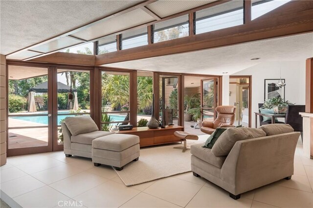 1501 Clearview Ln, North Tustin, CA 92705 - living room featuring french doors, tile patterned flooring, lofted ceiling, and expansive windows