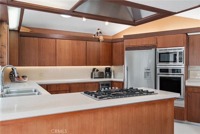 1501 Clearview Ln, North Tustin, CA 92705 - kitchen featuring built in appliances, brown cabinets, light countertops, and vaulted ceiling